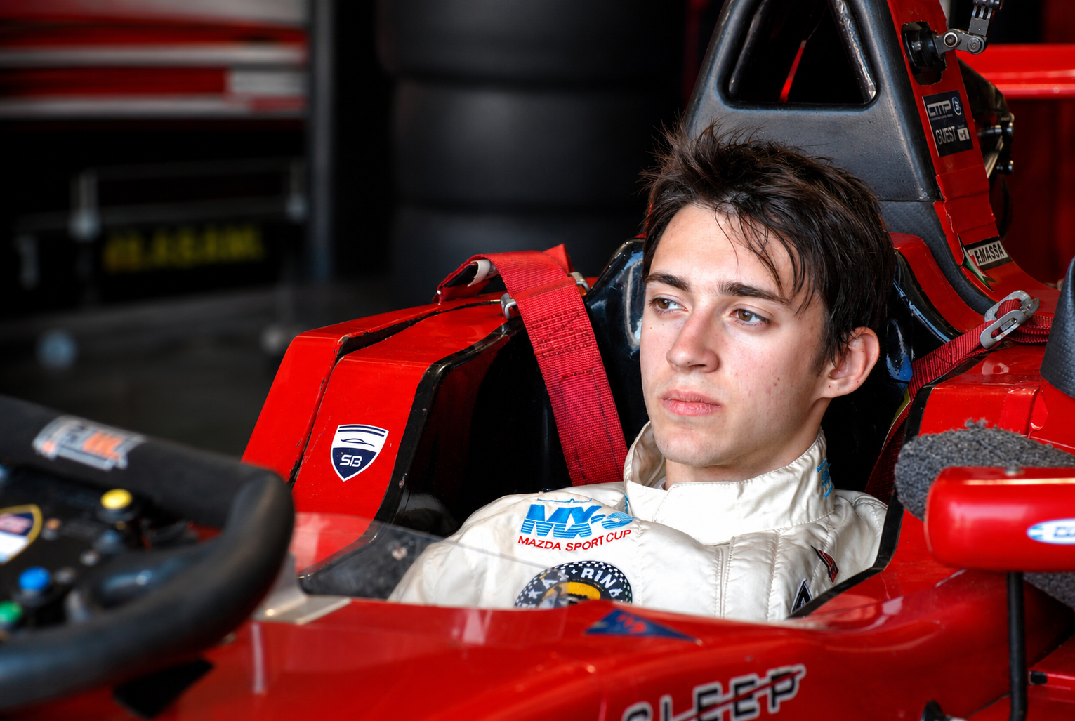 Formula car in garage during race preparation
