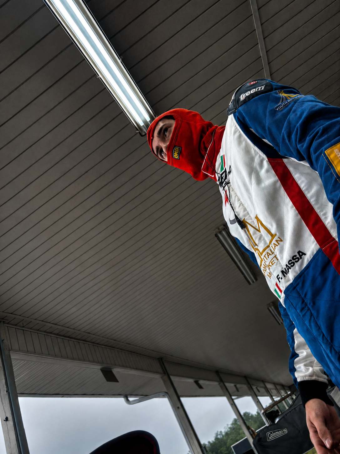 Filippo Massa in red suit during CMP 2026 pre-session preparation