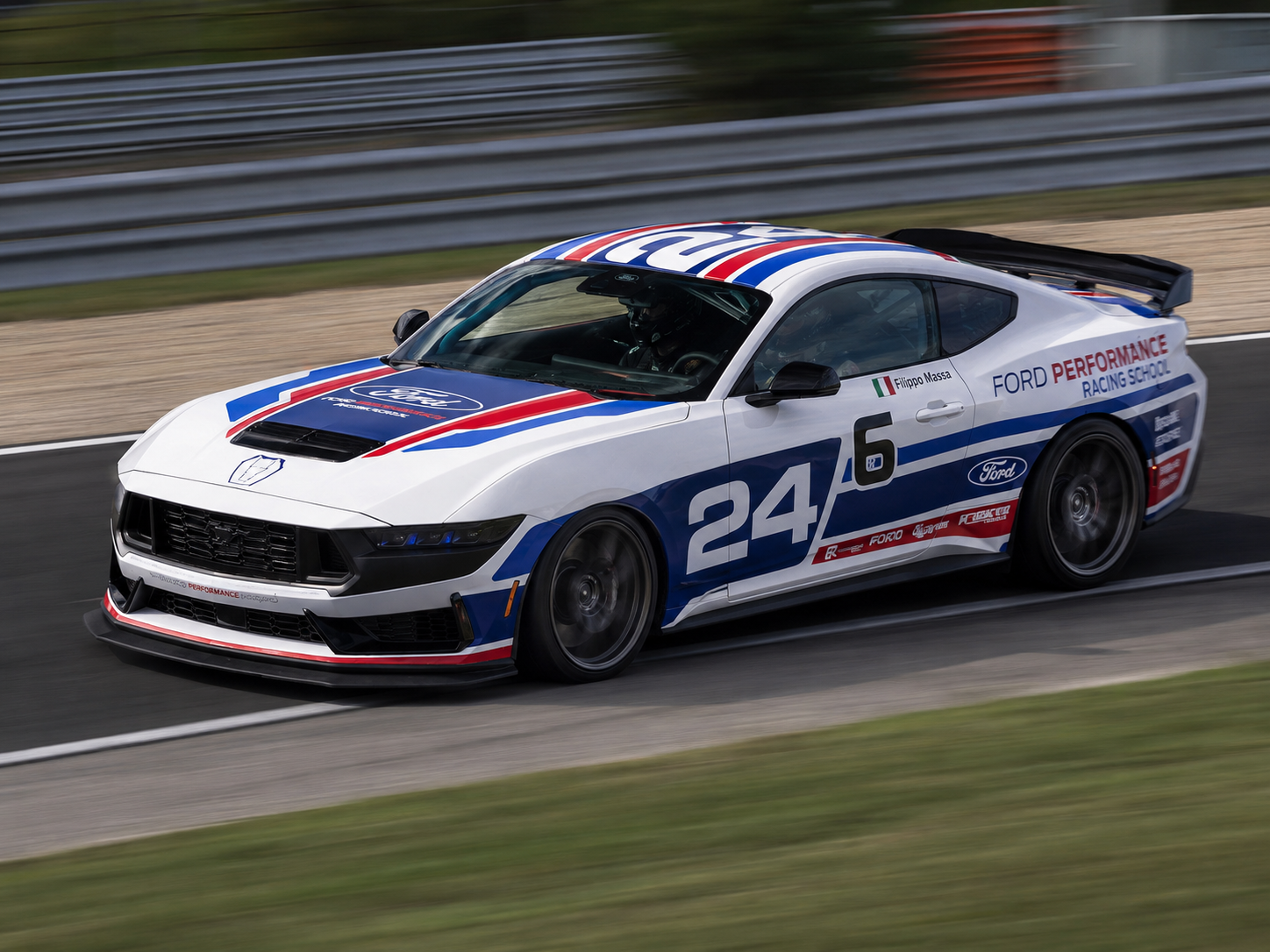 Dark Horse race car on track during driver development