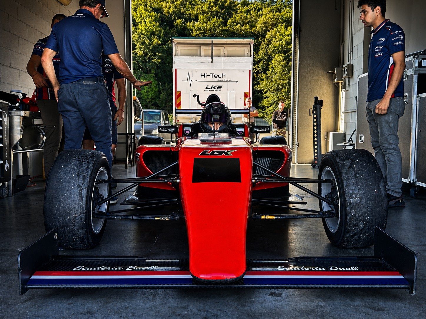 Red formula car front view prepared for track activity