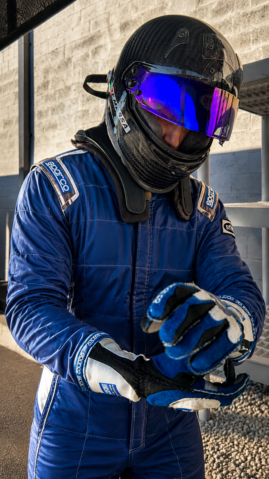 Filippo Massa adjusting racing gloves before a session